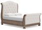 Ardenfield Queen Upholstered Sleigh Bed with Mirrored Dresser and Chest