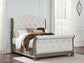 Ardenfield Queen Upholstered Sleigh Bed with Mirrored Dresser and Chest