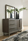 Arkenton King Panel Bed with Mirrored Dresser